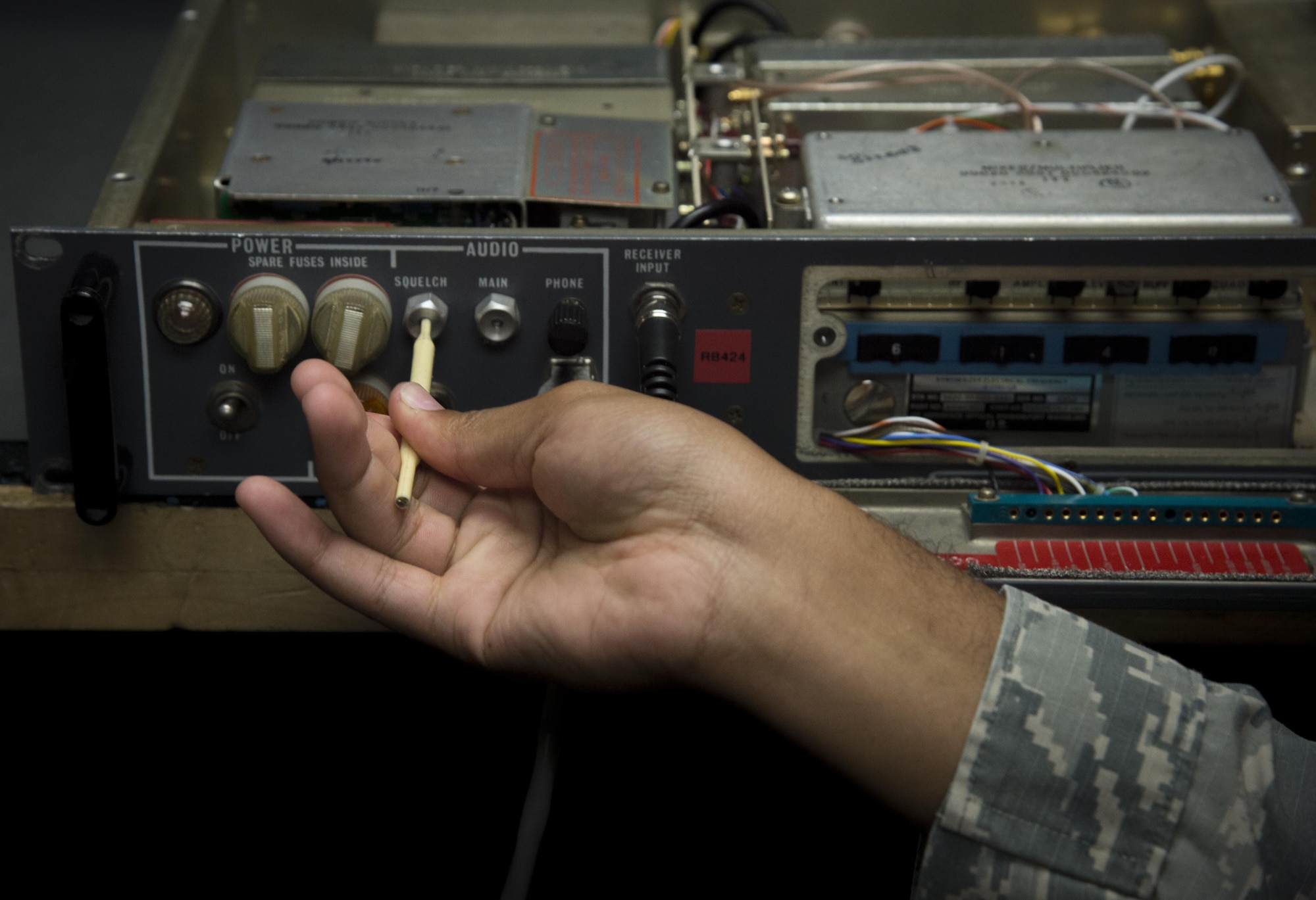 Airman 1st Class Keith Hickson Jr., a cable and antenna maintenance technician assigned to the 6th Communications Squadron, adjusts a radio during a Shadow Program at MacDill Air Force Base, Fla. Oct. 18, 2017. Hickson toured various work areas during the day to include air traffic control, weather, and Survival Evasion Resistance and Escape specialists and learned about each career field. (U.S. Air Force photo by Senior Airman Mariette Adams)