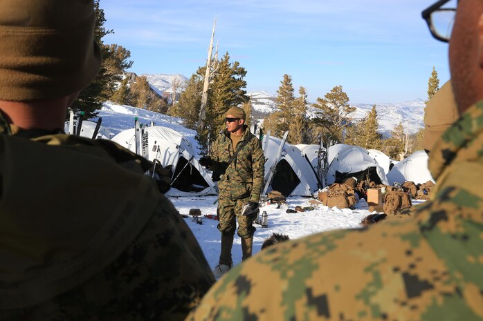 Capt. Tyrone Barrion, an engineer officer with 1st Combat Engineer Battalion(CEB), 1st Marine Division gives the after action report about ice breaching and avalanche initiation during Mountain Training Exercise 2-17, Marine Corps Mountain Warfare Training Center (MCMWTC) Bridgeport, Calif., March 17, 2017.