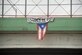 A flag hangs from a highway overpass that reads “Estamos de pie,” in Caguas, Puerto Rico, Oct. 2, 2017. “Estamos de pie” translates to “We are standing,” which is meant to motivate people to stay strong and overcome the disaster left behind Hurricane Maria.