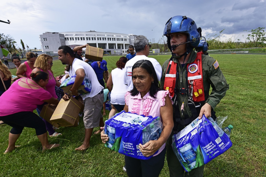 Coast Guard delivers aid to residents.