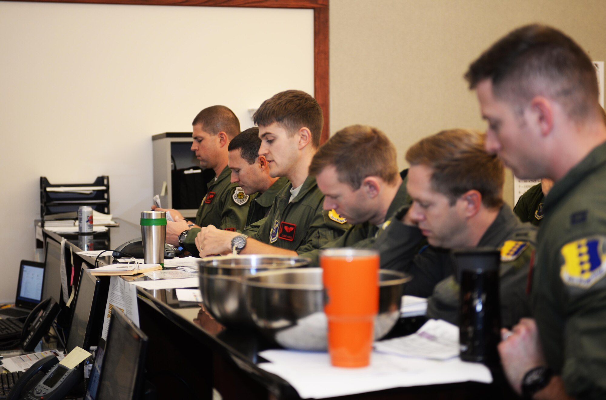 Capt. Ryan Kerns, an instructor pilot assigned to the 34th Bomb Squadron, gives a mission brief before aircrew members depart from Ellsworth Air Force Base, S.D., for the Green Flag exercise 18-1 on Oct. 18, 2017. Aircrew members will be flying in air-to-ground missions for U.S. Army units on the ground. Green Flag exercises focuses on close-air support training which is different from Red Flag exercises which focus on air-to-air combat missions. (U.S. Air Force photo by Airman 1st Class Thomas Karol)