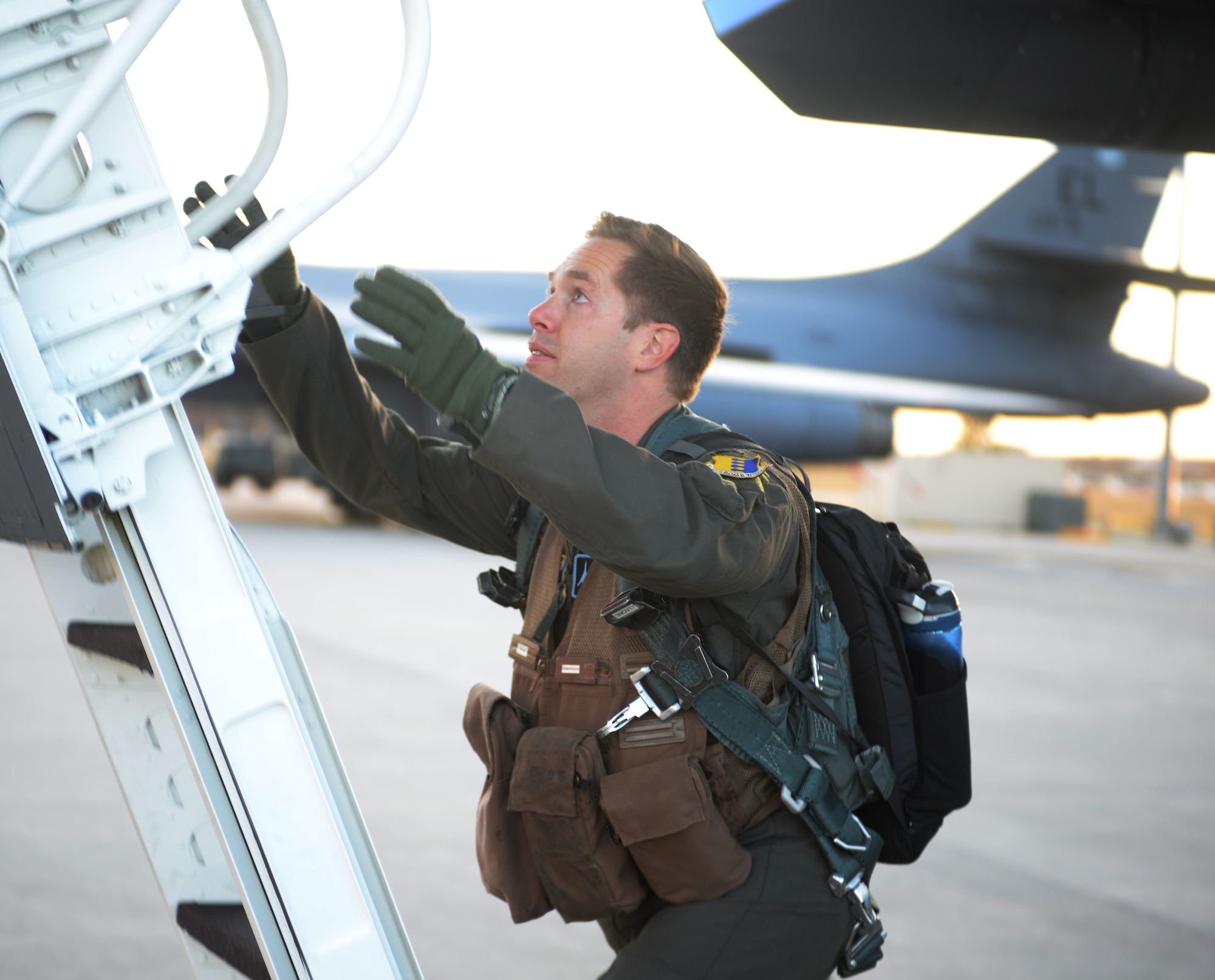 Capt. Ryan Koelling, a weapons system officer assigned to the 34th Bomb Squadron, boards a B-1 Bomber at Ellsworth Air Force Base, S.D., Oct. 18, 2017. Approximately 200 Ellsworth Airmen departed for Nellis AFB, to train with Joint Terminal Attack Controllers and soldiers from U.S. Army National Training Center in Fort Irwin, Calif., as part of Green Flag exercise 18-1. (U.S. Air Force photo by Airman 1st Class Thomas Karol)