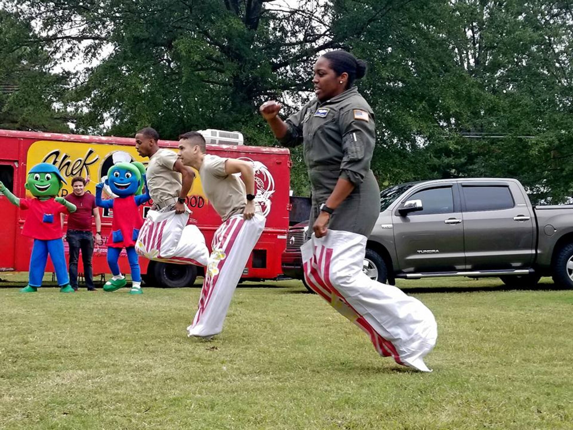 Reserve Citizen Airmen participate in a potato sack race at this year's Family Day Oct. 14, 2017 at Dobbins Air Reserve Base, Ga. Family Day is held here annually as a way of bringing families on base to see what their Reserve Citizen Airmen do on drill weekends. (U.S. Air Force photo/Senior Airman Lauren Douglas)