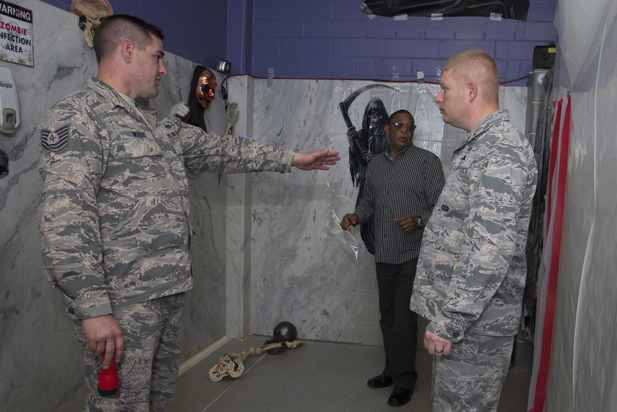 Members from the 6th Air Mobility Wing Safety office and Civil Engineer Squadron perform a safety inspection of the MacThrillville haunted house at MacDill Air Force Base, Fla., Oct. 20, 2017. Safety is MacDill’s number one priority to ensure all families have an enjoyable time this Halloween. (U.S. Air Force photo by Airman 1st Class Ashley Perdue)