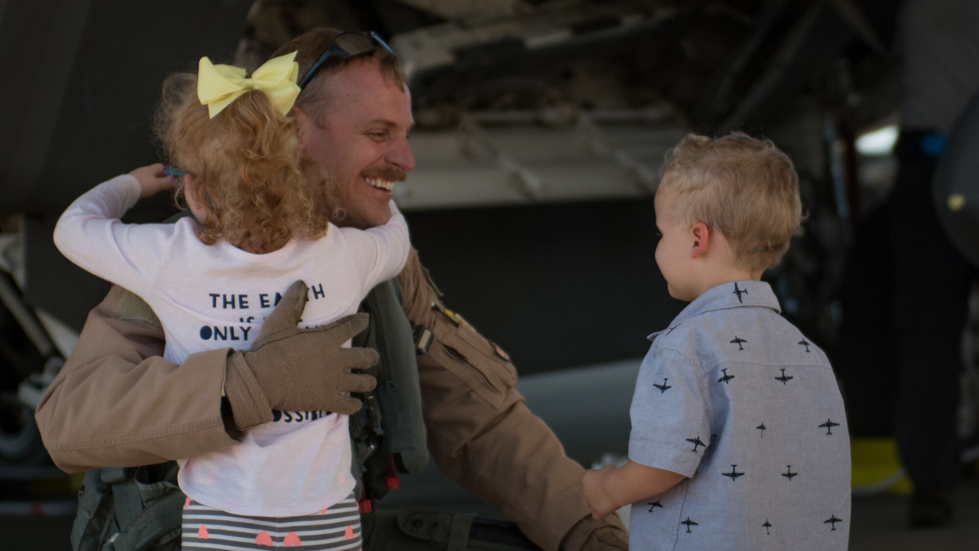 U.S. Air Force Lt. Col. Christian Bergtholdt, 27th Fighter Squadron director of operations, embraces his children upon returning to Joint Base Langley-Eustis, Va., Oct. 19, 2017.