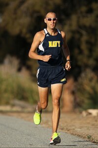 Patrick Hearn, assigned to Naval Surface Warfare Center (NSWC), Corona Division, runs around Lake Norconian.