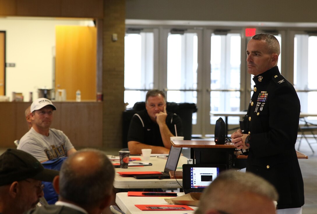 Colonel David Fallon, the 9th Marine Corps District commanding officer, speaks with wrestling coaches during the National Wrestling Coaches Association’s Leadership Academy at Shawnee High School, Oct. 19. Fallon spoke to coaches about traits Marines and wrestlers share that make them stand out in society. (Official U.S. Marine photo by Sgt. Marcela Diazdeleon)