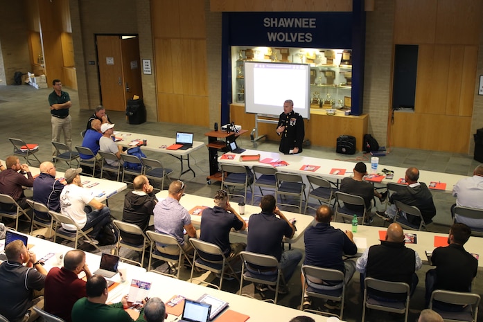 Colonel David Fallon, the 9th Marine Corps District commanding officer, speaks with wrestling coaches during the National Wrestling Coaches Association’s Leadership Academy at Shawnee High School, Oct. 19. Fallon spoke to coaches about traits Marines and wrestlers share that make them stand out in society. (Official U.S. Marine photo by Sgt. Marcela Diazdeleon)