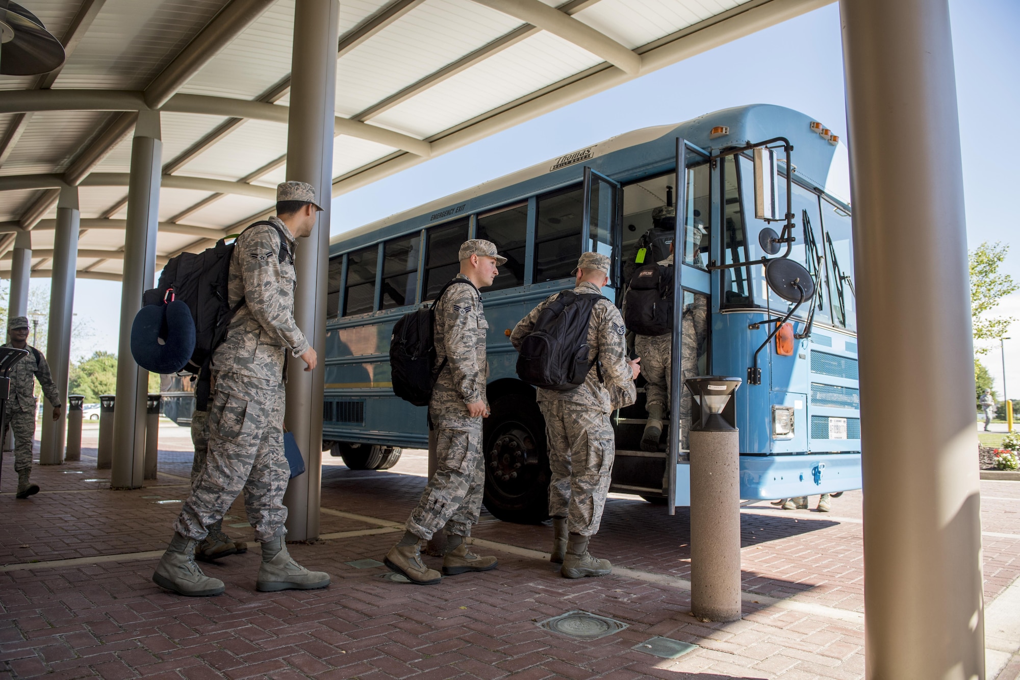 Airmen assigned to the 633rd Medical Group load a bus heading to the passenger terminal to deploy to provide aid to Puerto Rico from Joint Base Langley-Eustis, Va., Oct. 17, 2017. Approximately 90 JB Langley-Eustis Airmen deployed as a global response force to provide expeditionary medical care to Puerto Rico residents. (U.S. Air Force photo by Tech. Sgt. Rasheen Douglas)
