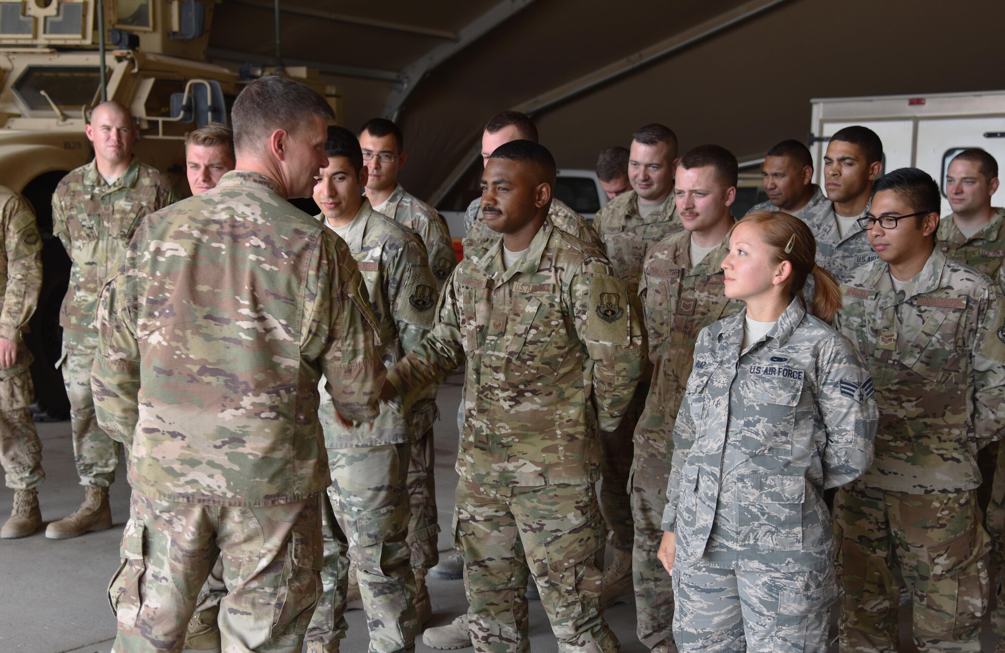 U.S. Air Force Brig. Gen. Kyle Robinson, 332nd Air Expeditionary Wing commander, shakes hands with 407th Expeditionary Logistics Readiness Squadron members Oct. 20, 2017, in Southwest Asia. Robinson visited the 407th Air Expeditionary Group to meet star performers and tour base facilities. (U.S. Air Force photo by Staff Sgt. Joshua Edwards/Released)