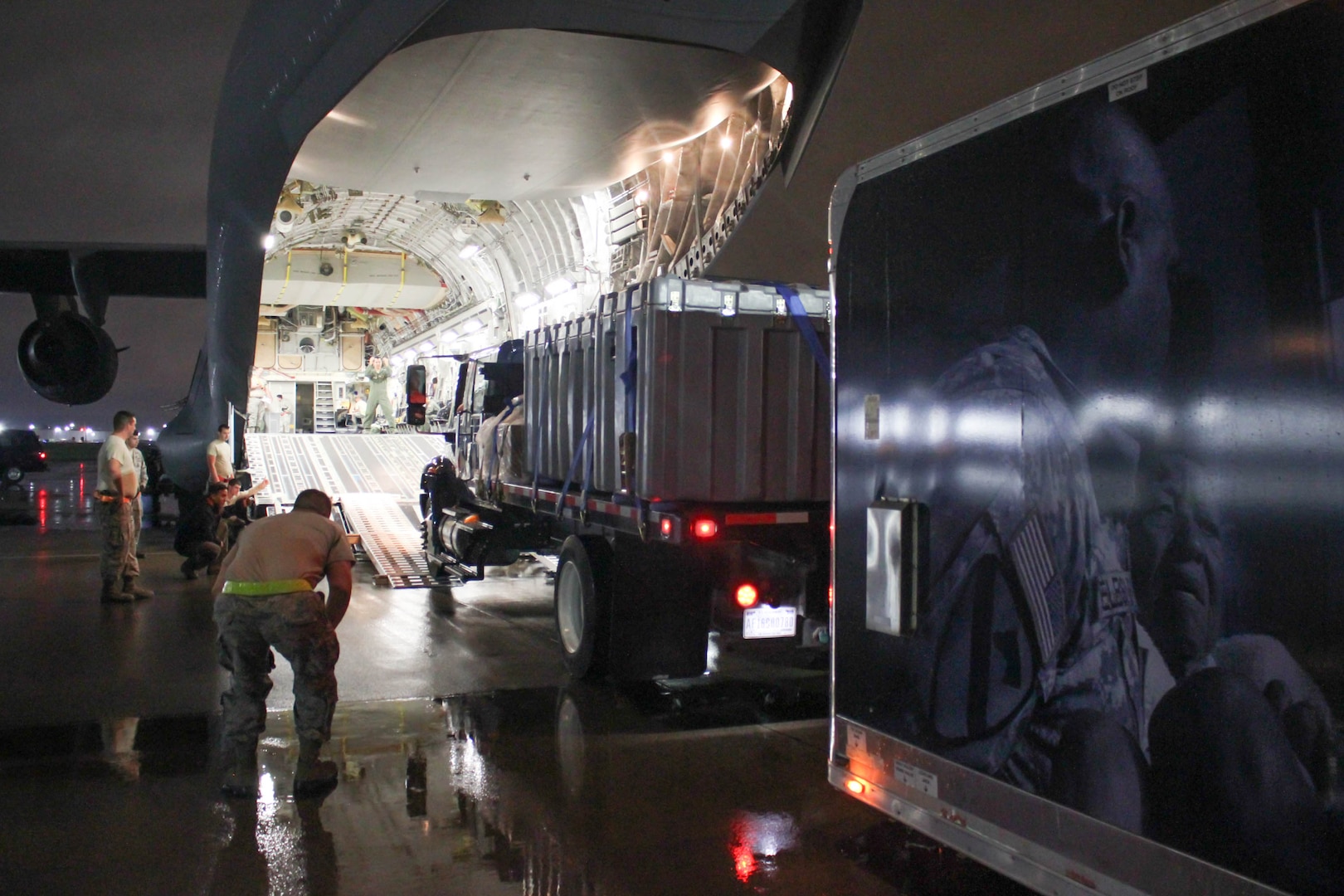 Airmen from the 123rd Airlift Wing load a Disaster Relief Mobile Kitchen Trailer onto a C-17 Globemaster III aircraft at the Kentucky Air National Guard Base in Louisville, Ky., Oct. 11, 2017, to be transported to San Juan, Puerto Rico. Seven Airmen from the wing’s 123rd Services Flight will employ the trailer to serve up to 4,000 hot meals per day to hurricane relief forces. (U.S. Air National Guard photo by Lt. Col. Katrina Bramlett)
