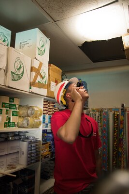 U.S. Army Corps of Engineers, Structural Engineer, Ariel A. Marrero Irizarry, assesses a school in Carolina, Puerto Rico on October 20, 2017.