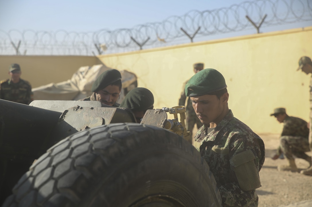 Afghan National Army soldiers with Artillery Brigade, 215th Corps prepare to conduct a notional firing exercise using a 122mm howitzer D-30 at Camp Shorabak, Afghanistan, Oct. 21, 2017. U.S. Marine advisors with Task Force Southwest are instructing an eight-week artillery course to more than 20 ANA soldiers with the brigade. The students are all forward observers, artillery crewmen or part of a fire direction control team, and are learning how to properly employ artillery to support combat missions throughout Helmand province. (U.S. Marine Corps photo by Sgt. Lucas Hopkins)