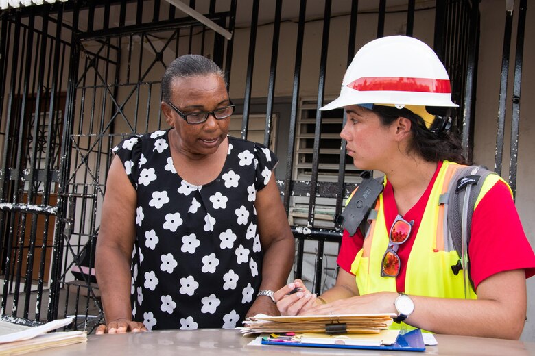 U.S. Army Corps of Engineers, Environmental Engineer Linoshka Soto-Perez fills out assessment and Right of Entry Form with Christobolina De Los Santos, in Las Margaritas, San Juan, Puerto Rico, on October 17, 2017.