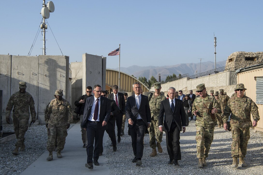 Defense Secretary Jim Mattis walks with civilian and military leaders in Afghanistan.