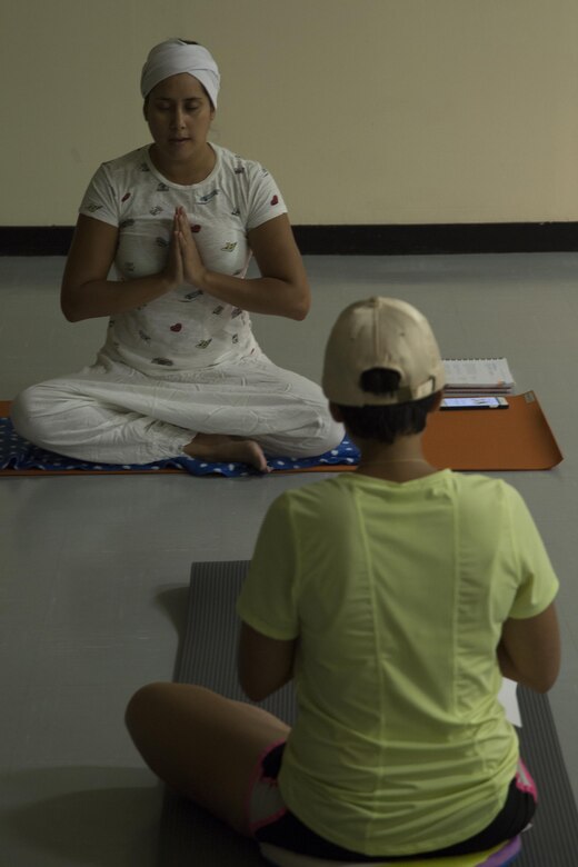 CAMP FOSTER, OKINAWA, Japan – Sandra Gonzalez leads the students through a breathing exercise at the USO Kundalini Yoga class Oct. 17 aboard Camp Foster, Okinawa, Japan.