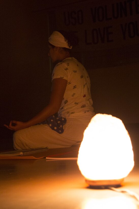 CAMP FOSTER, OKINAWA, Japan – A practitioner meditates in the light of a salt rock light USO Kundalini Yoga class Oct. 17 aboard Camp Foster, Okinawa, Japan.