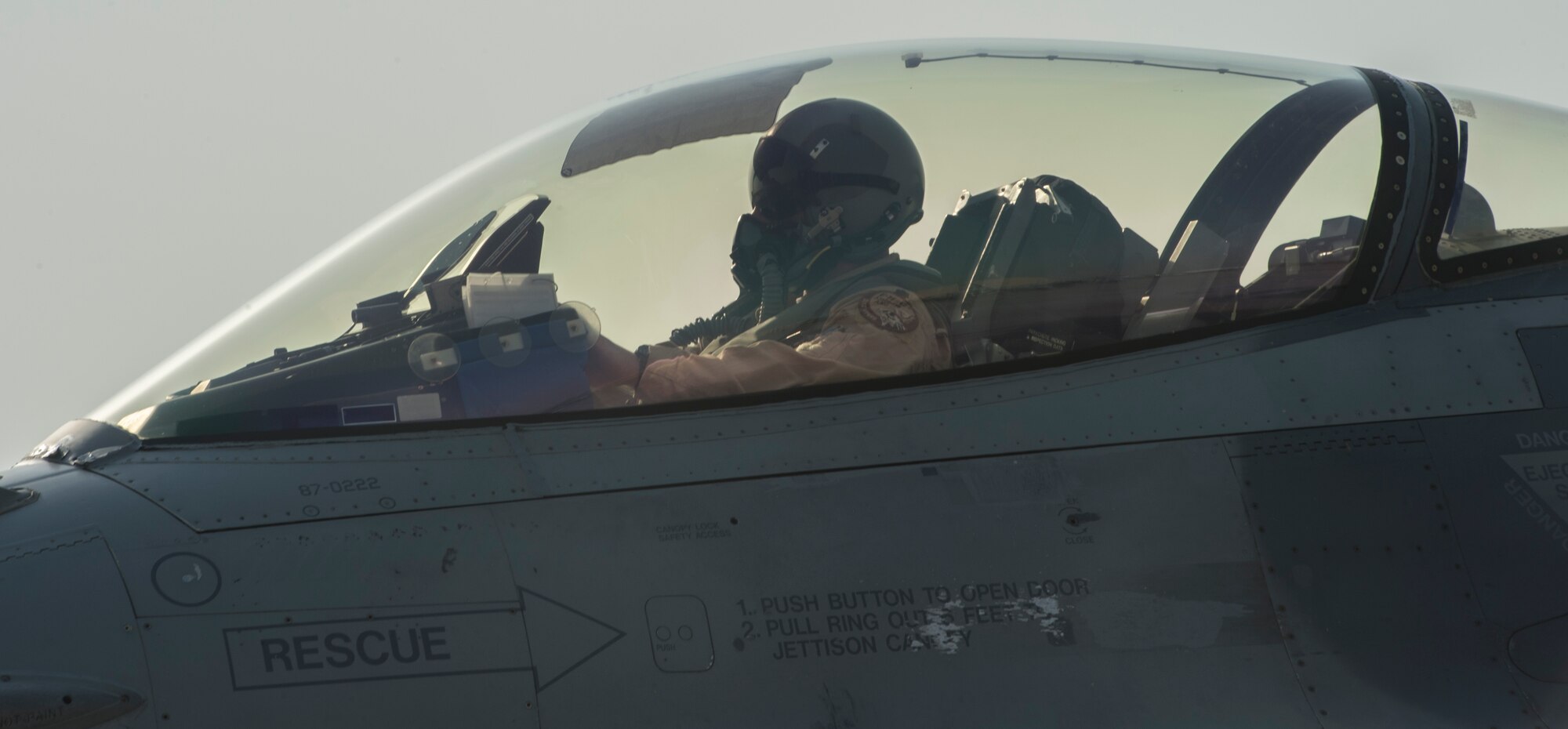 An F-16 Fighting Falcon pilot from the 100th Fighter Squadron arrives at the 407th Air Expeditionary Group in Southwest Asia, Oct. 16, 2017. In an air-to-surface role, the F-16 can fly more than 500 miles, deliver its weapons with superior accuracy, defend itself against enemy aircraft and return to its starting point. (U.S. Air Force photo by Staff Sgt. Sean Martin/Released)
