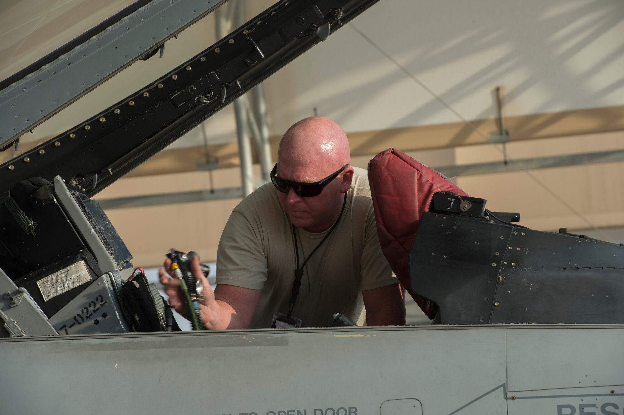 U.S. Air Force Master Sgt. William Tittsworth, 100th Fighter Squadron F-16 Fighting Falcon crew chief, performs post flight procedures at the 407th Air Expeditionary Group in Southwest Asia, Oct. 16, 2017. Aircraft Maintenance is responsible for generation of assigned aircraft. Aircraft generation is the cumulative effort required to service, inspect, maintain, launch, and recover assigned aircraft.  (U.S. Air Force photo by Staff Sgt. Sean Martin/Released)