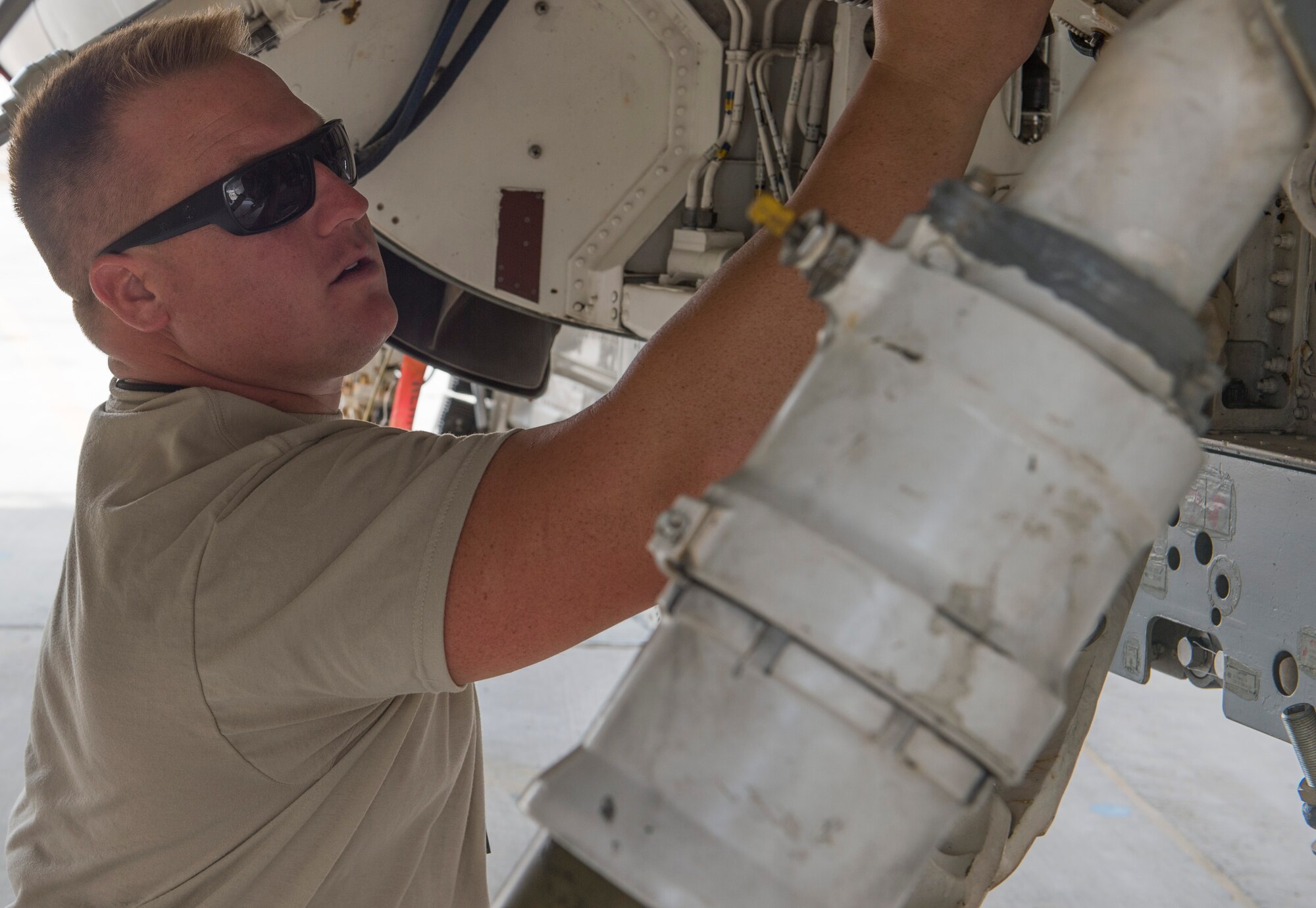 U.S. Air Force Tech. Sgt. J.C. Baxley, 100th Fighter Squadron crew chief, performs a pre-flight inspection on an F-16 Fighting Falcon at the 407th Air Expeditionary Group in Southwest Asia, Oct. 18, 2017. Aircraft Maintenance is responsible for generation of assigned aircraft. Aircraft generation is the cumulative effort required to service, inspect, maintain, launch, and recover assigned aircraft. (U.S. Air Force photo by Staff Sgt. Sean Martin/Released)