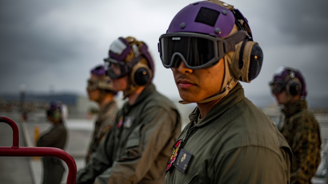 U.S. Marines and Master Labor Contractors with the Logistics Department Fuels Division observe the Aircraft Direct Fueling System