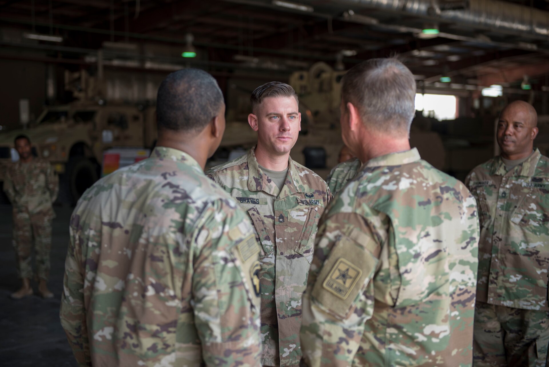 Three soldiers standing together in a group.
