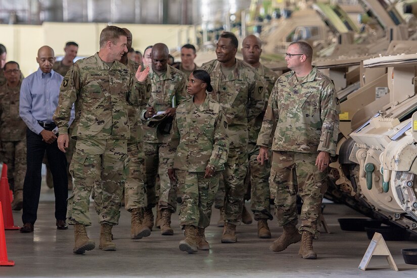 Group of Soliders walking through a warehouse