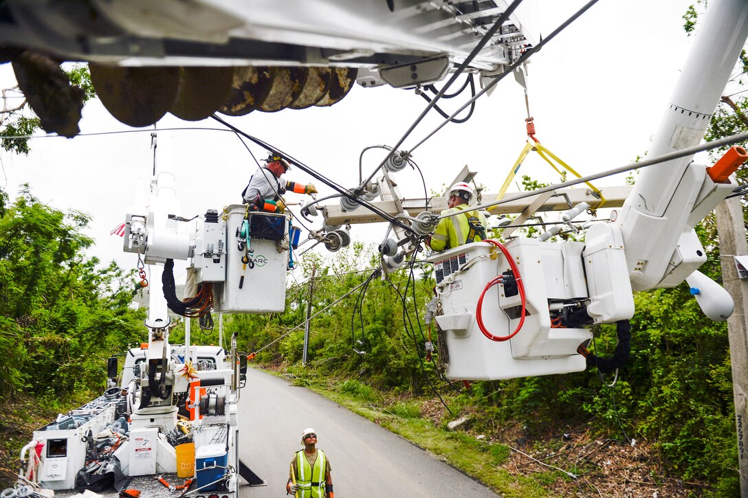 Army Reservists repair power lines in Puerto Rico.