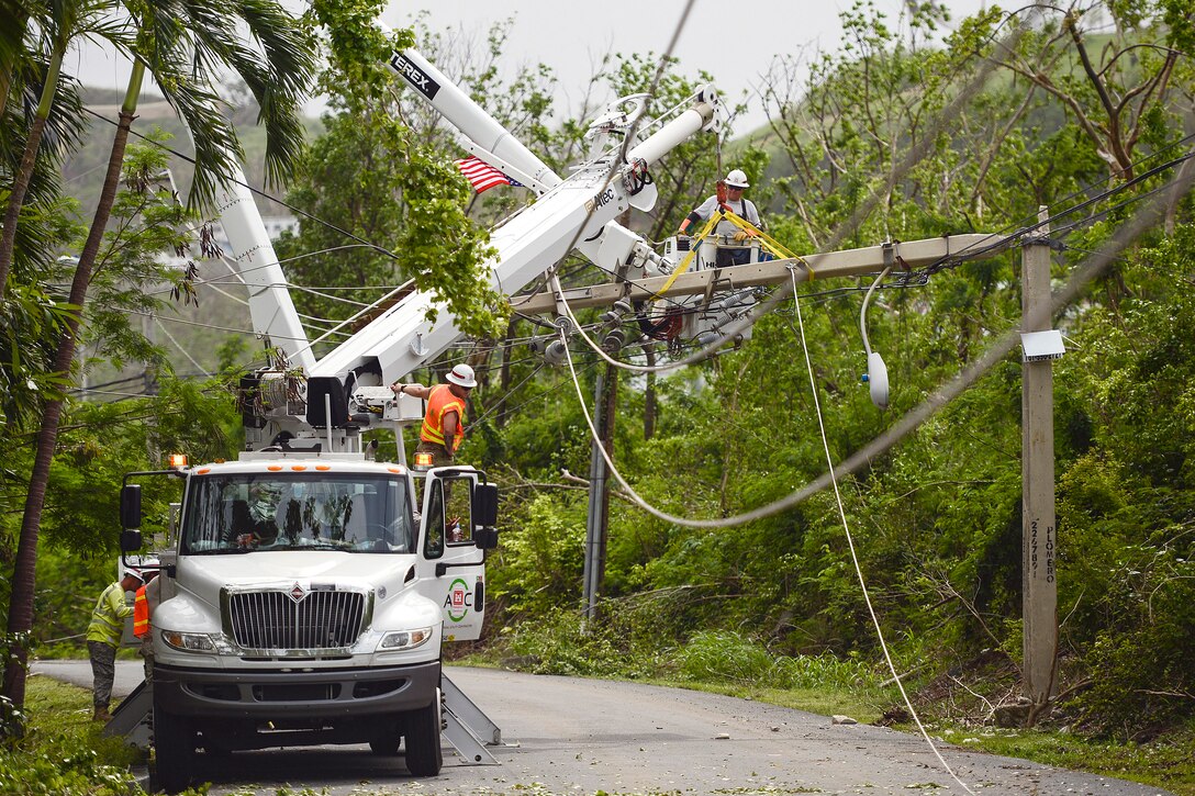 Army Reservists repair power lines in Puerto Rico.