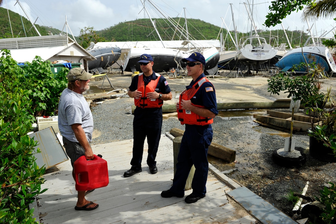 Guardsmen assessing vessels after Hurricane Maria.