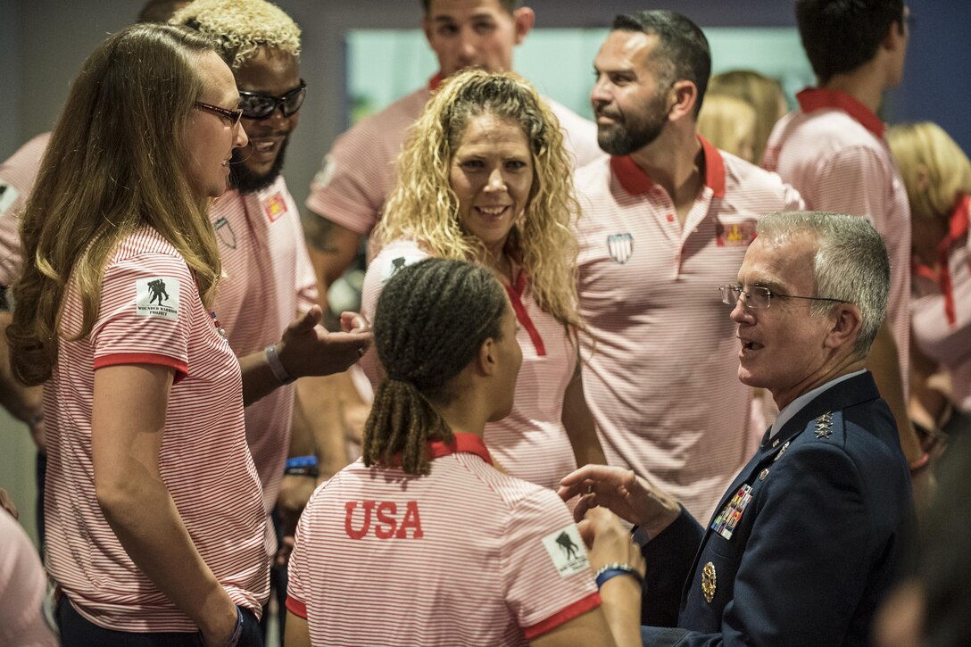 The vice chairman of the Joint Chiefs of Staff talks with military athletes from Team U.S.