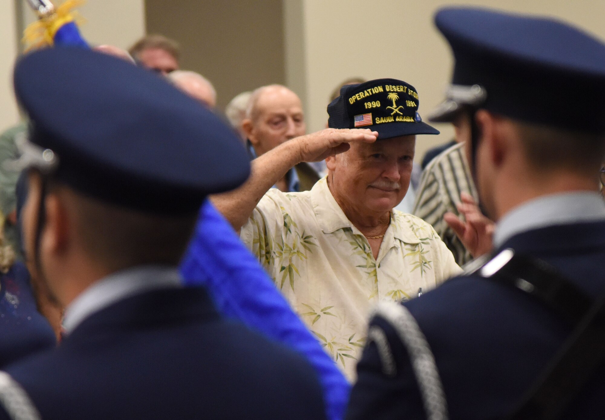 U.S. Army retired Sgt. 1st Class Tom Carpenter renders a salute during the singing of the national anthem during Retiree Appreciation Day at the Roberts Consolidated Aircraft Maintenance Facility Oct. 20, 2017, on Keesler Air Force Base, Mississippi. The annual event, sponsored by the Keesler Retiree Activities Office, included more than 20 displays with information pertinent to retirees and a free lunch. (U.S. Air Force photo by Kemberly Groue)