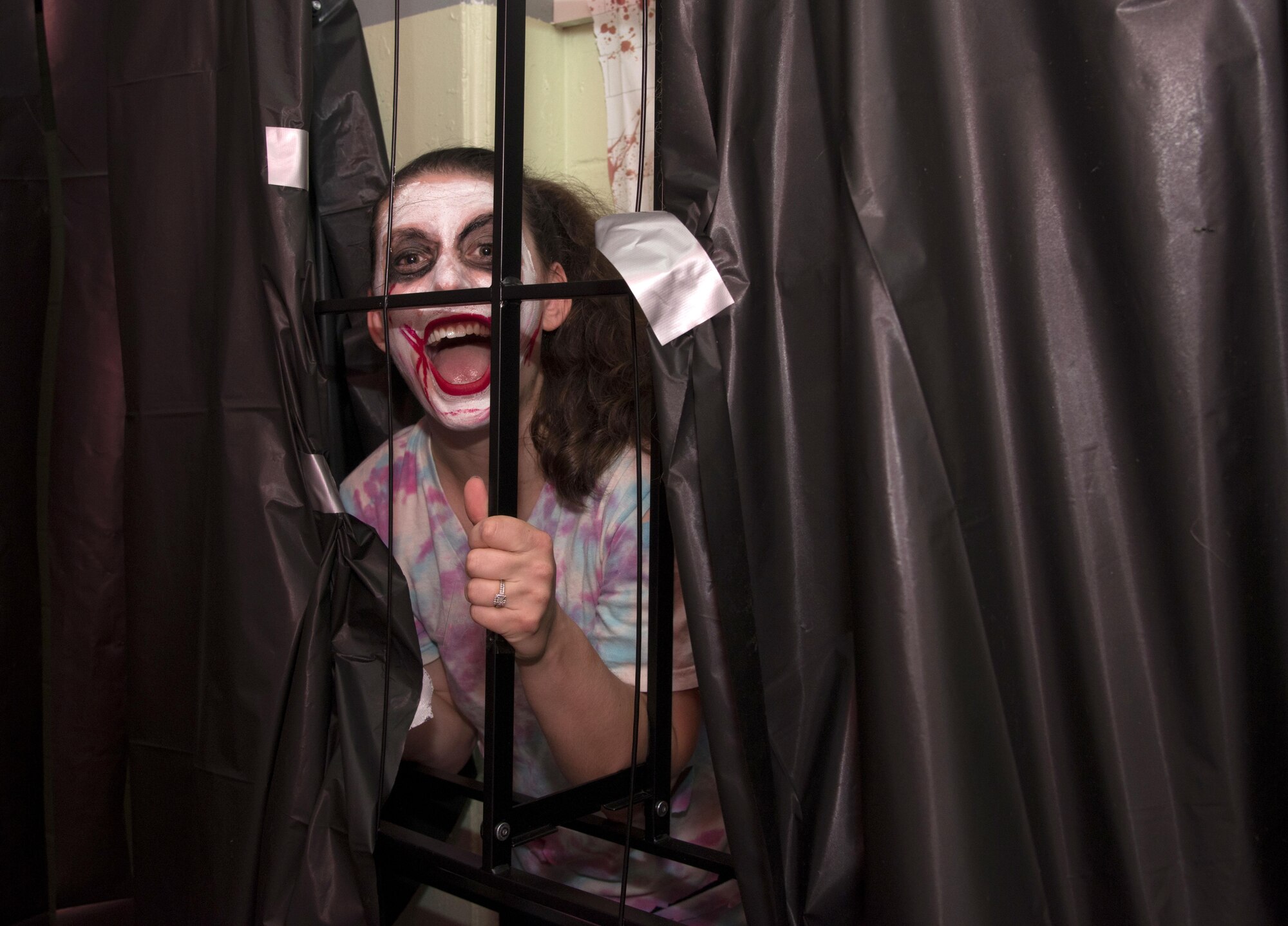 Airman 1st Class Heather Fejerang, broadcast journalist with the 6th Air Mobility Wing Public Affairs office, participates at the MacThrillville haunted house at MacDill Air Force Base, Fla., Oct. 20, 2017.