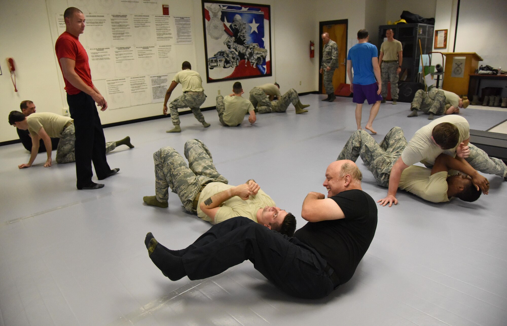 Members of the 81st Security Forces Squadron practice combative techniques during an 81st SFS combative training course at the SFS building Oct. 19, 2017, on Keesler Air Force Base, Mississippi. Approximately 15-20 defenders were taught skills vital to surviving a hand-to-hand ground fight using mixed martial arts and Jiu Jitsu techniques as another tool to survive a confrontational environment. (U.S. Air Force photo by Kemberly Groue)
