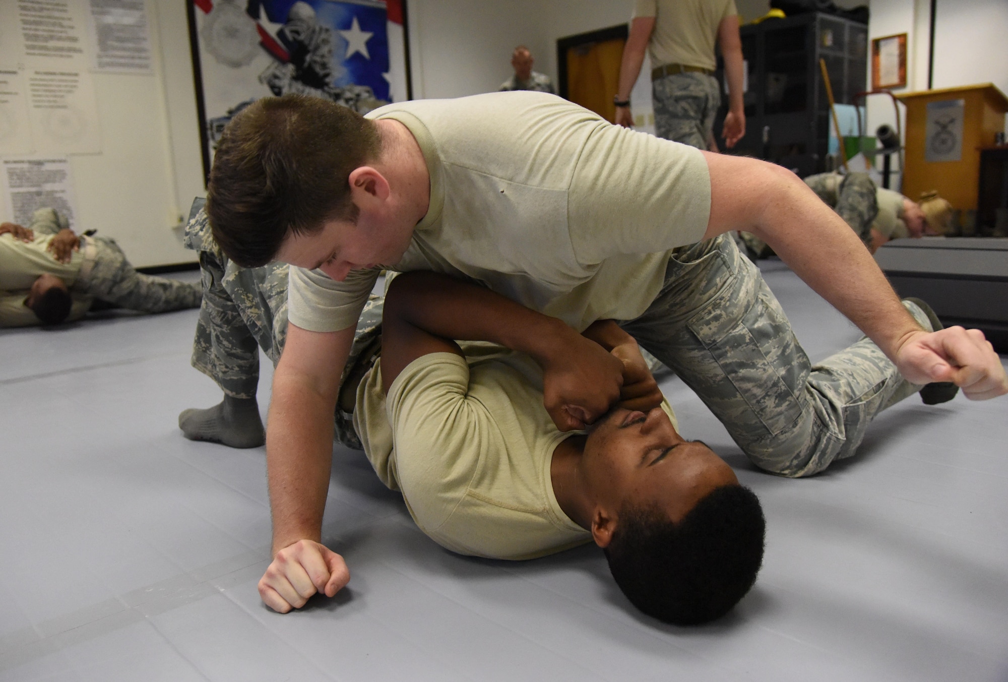 Senior Airman Jordan Johnson, 81st Security Forces Squadron patrolman, and Staff Sgt. Forrest Washington, 81st SFS patrolman, practice a combative technique during an 81st SFS combative training course at the SFS building Oct. 19, 2017, on Keesler Air Force Base, Mississippi. Approximately 15-20 defenders were taught skills vital to surviving a hand-to-hand ground fight using mixed martial arts and Jiu Jitsu techniques as another tool to survive a confrontational environment. (U.S. Air Force photo by Kemberly Groue)