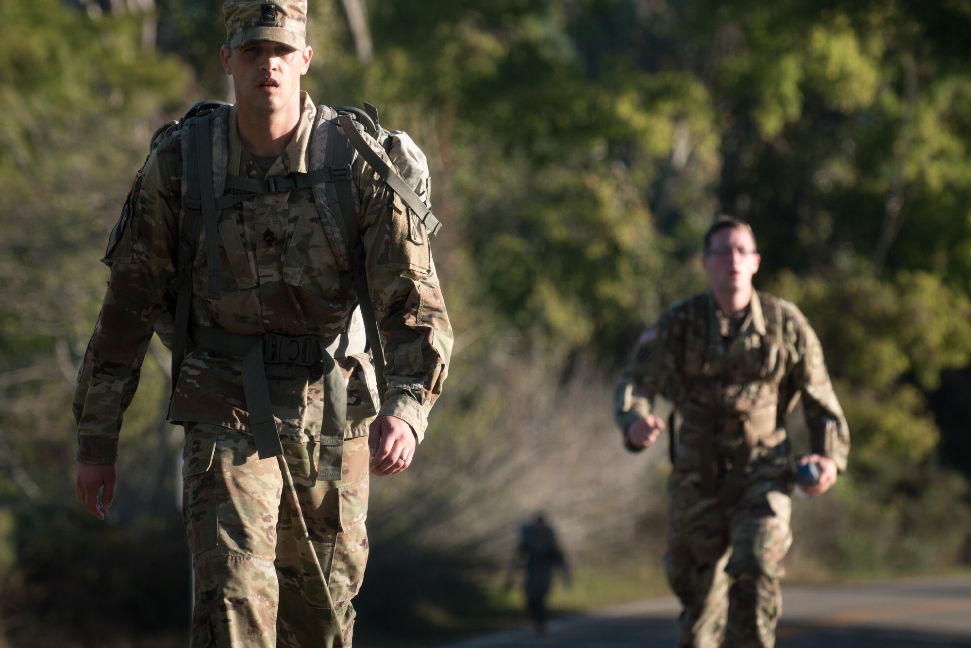 U.S. Army Soldiers ruck march during the German Armed Forces Proficiency Badge evaluation at Joint Base Langley-Eustis, Va., Oct. 19, 2017.