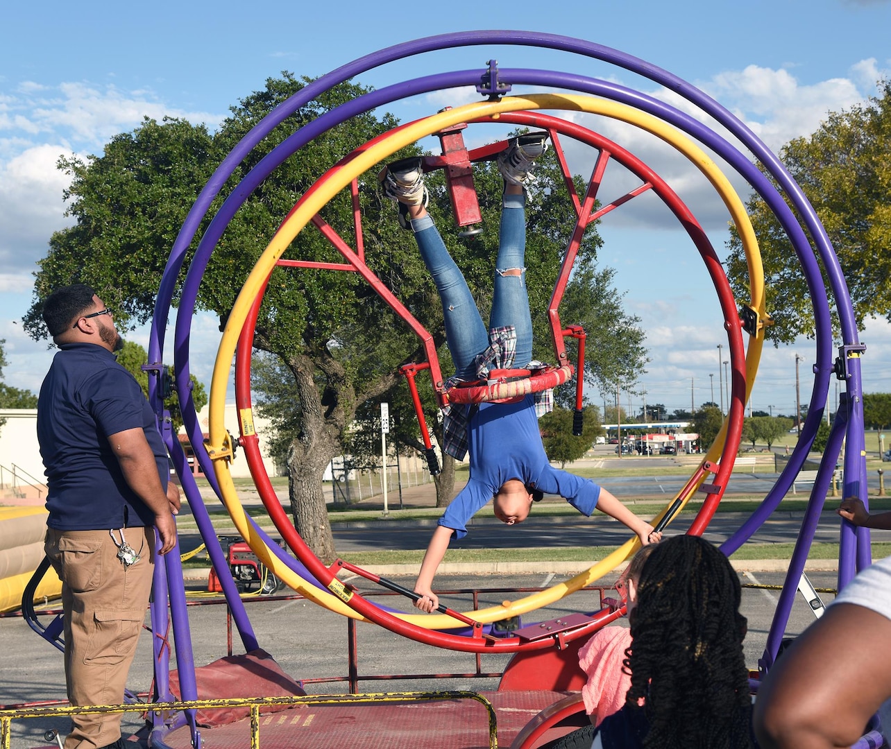 Even the kids were able to get in on the fun as this youngster goes upside down on an attraction at the annual Joint Base San Antonio-Fort Sam Houston Oktoberfest Oct. 21.