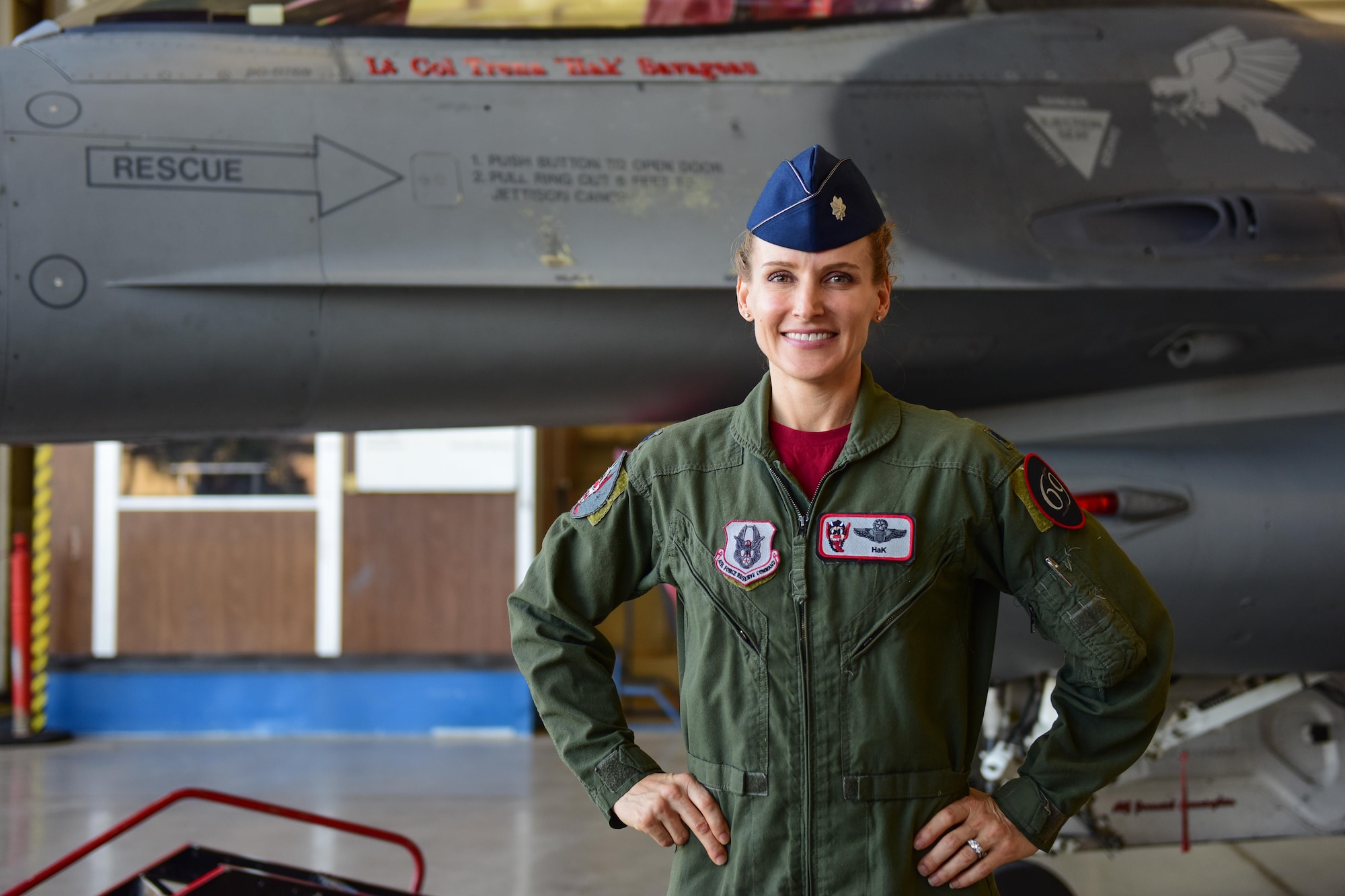 Lt. Col. Trena Savageau, incoming 69th Fighter Squadron commander, poses with an F-16 after the 69 FS change of command ceremony Oct. 10.