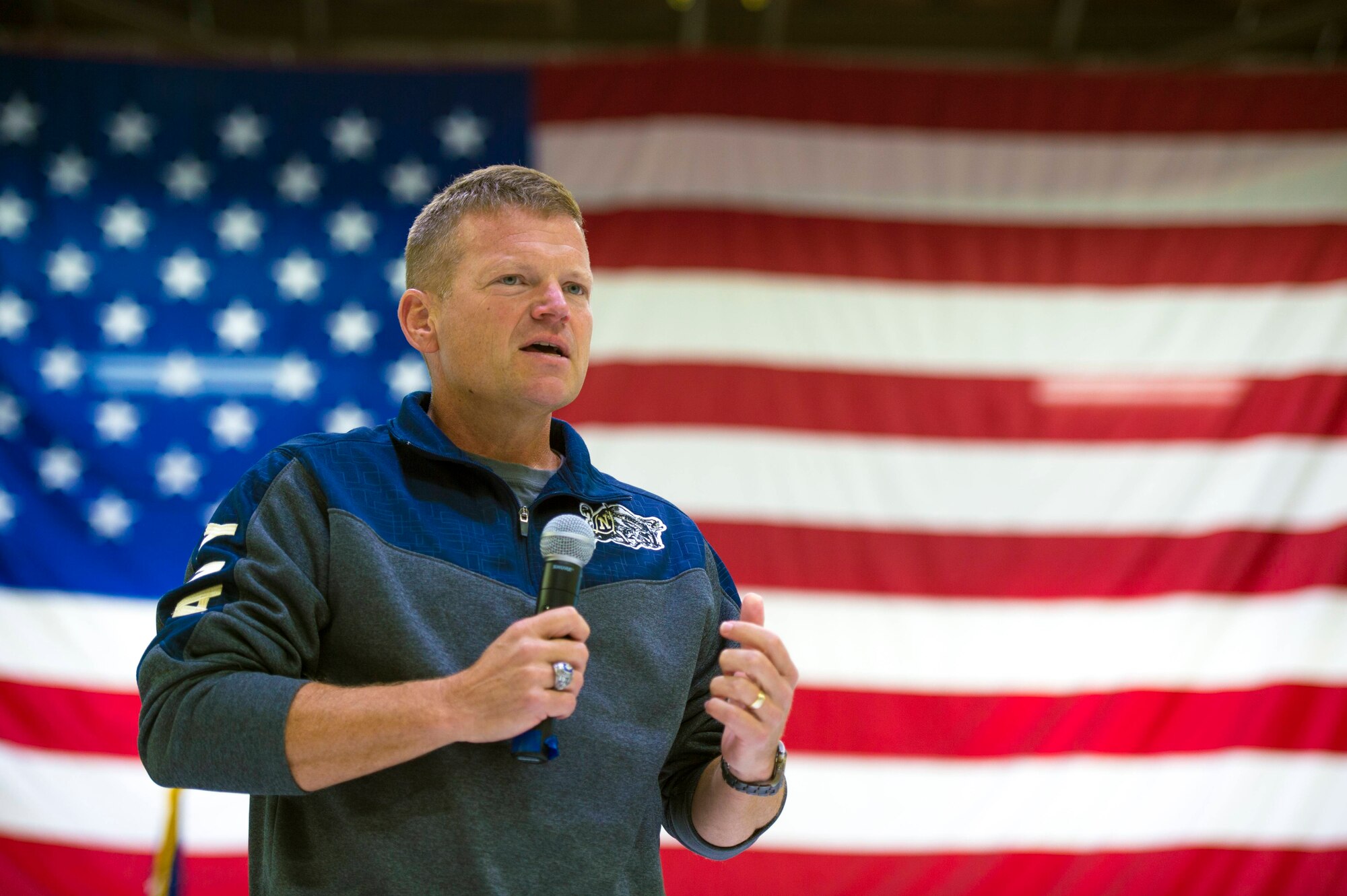 Col. Paul Gates, 434 Air Refueling Wing vice commander, speaks to his audience about the concept of wingmanship during Wingman Day at Grissom Air Reserve Base, Ind., October 15, 2017. Wingman Day is a Reserve-wide event held each year to bring Airmen together in a relaxed environment and encourage them to become better wingmen. (U.S. Air Force photo/ Senior Airman Harrison Withrow)