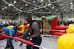 Attendees participate in a human-sized inflatable game of foosball during Wingman Day at Grissom Air Reserve Base, Ind., October 15, 2017. Wingman Day is a Reserve-wide event held each year to bring Airmen together in a relaxed environment and encourage them to become better wingmen. (U.S. Air Force photo/ Senior Airman Harrison Withrow)