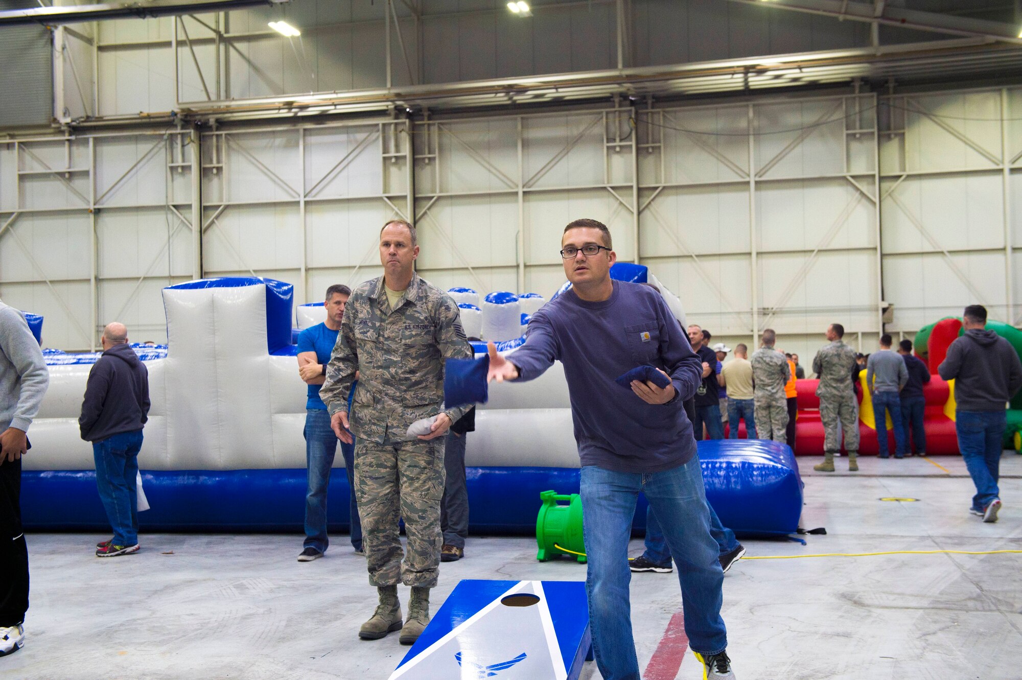 Master Sgt. Evan Heintz, 434 Maintenance Squadron fuel systems supervisor and Senior Master Sgt. Zach Chapin, 434 Air Refueling Wing superintendent of inspections, play a game of cornhole during Wingman Day at Grissom Air Reserve Base, Ind., October 15, 2017. Wingman Day is a Reserve-wide event held each year to bring Airmen together in a relaxed environment and encourage them to become better wingmen. (U.S. Air Force photo/ Senior Airman Harrison Withrow)