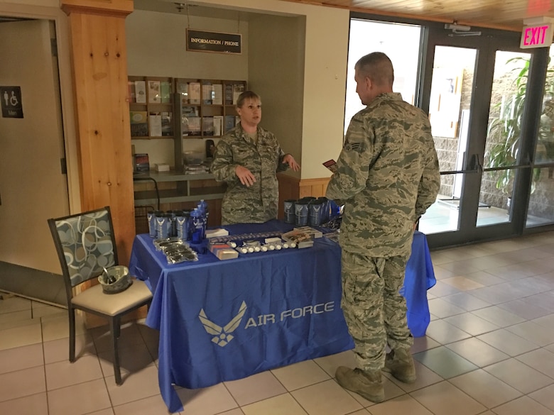 Master Sgt. Marsi Smith, the new 944th Fighter Wing maintenance recruiter, talks with a potential recruit at the Hensman Dining Facility Oct. 21.