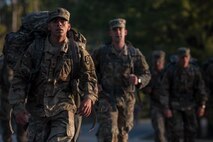 U.S. Army Sgt. Raquel Nunez-Hedrick, German Armed Forces Proficiency Badge competitor, dons her helmet before entering the shooting range at Joint Base Langley-Eustis, Va., Oct. 20, 2017.
