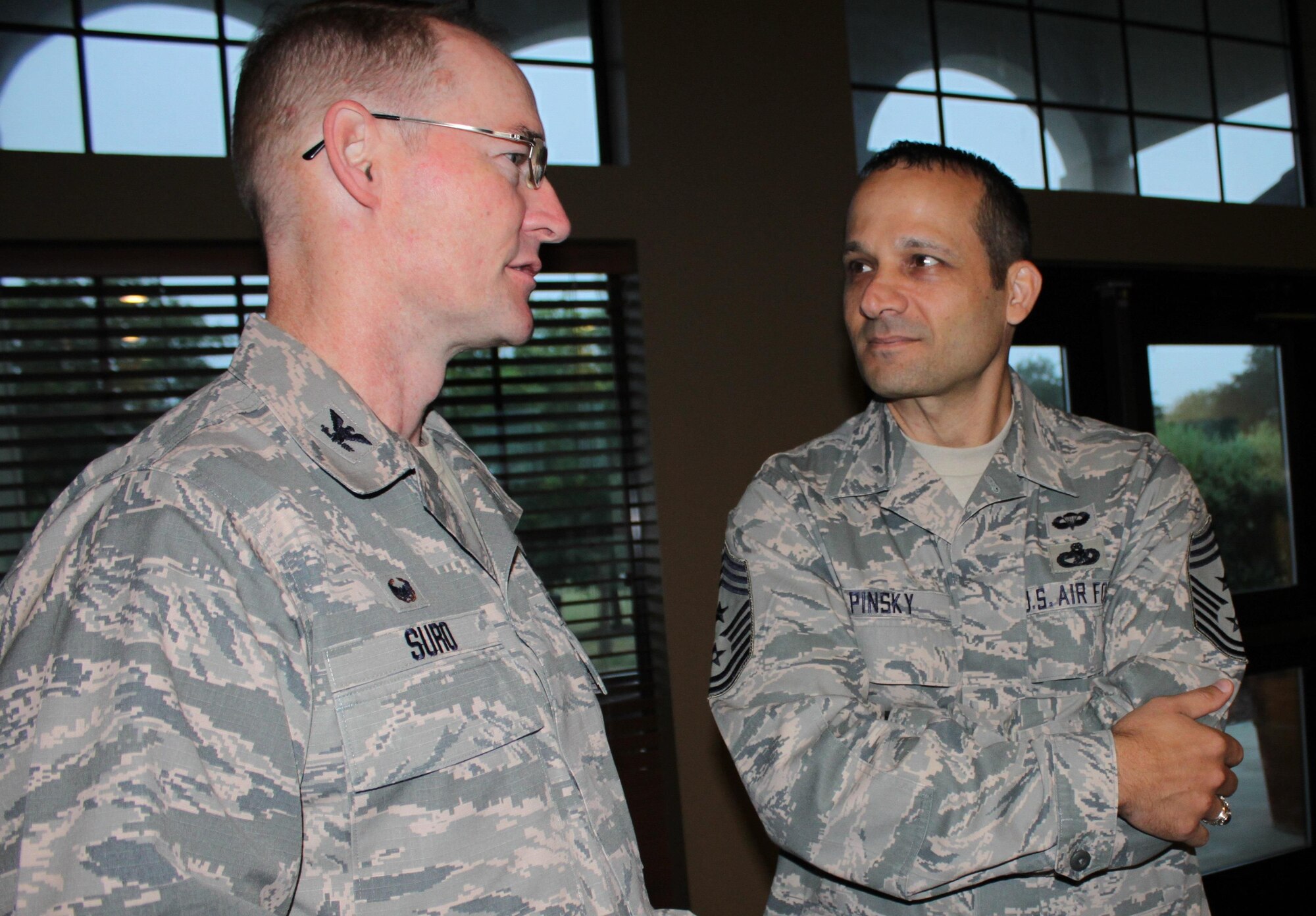 Col. Roger Suro, 340th Flying Training Group, chats with Chief Master Sgt. Brian Pinsky,