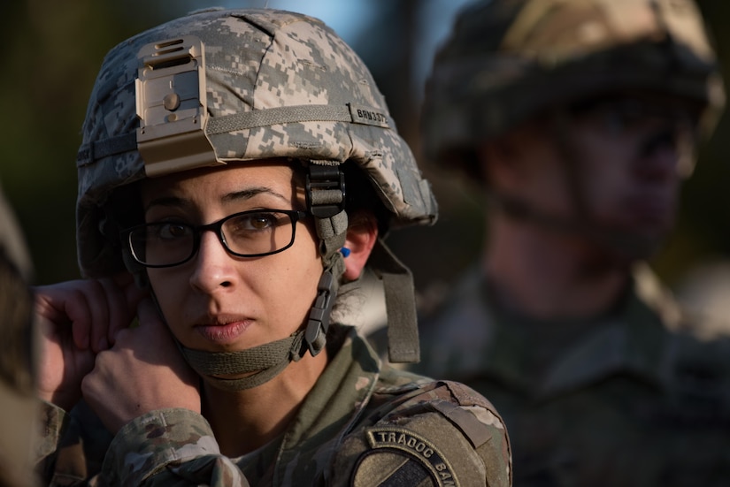 U.S. Army Sgt. Raquel Nunez-Hedrick, German Armed Forces Proficiency Badge competitor, dons her helmet before entering the shooting range at Joint Base Langley-Eustis, Va., Oct. 20, 2017.