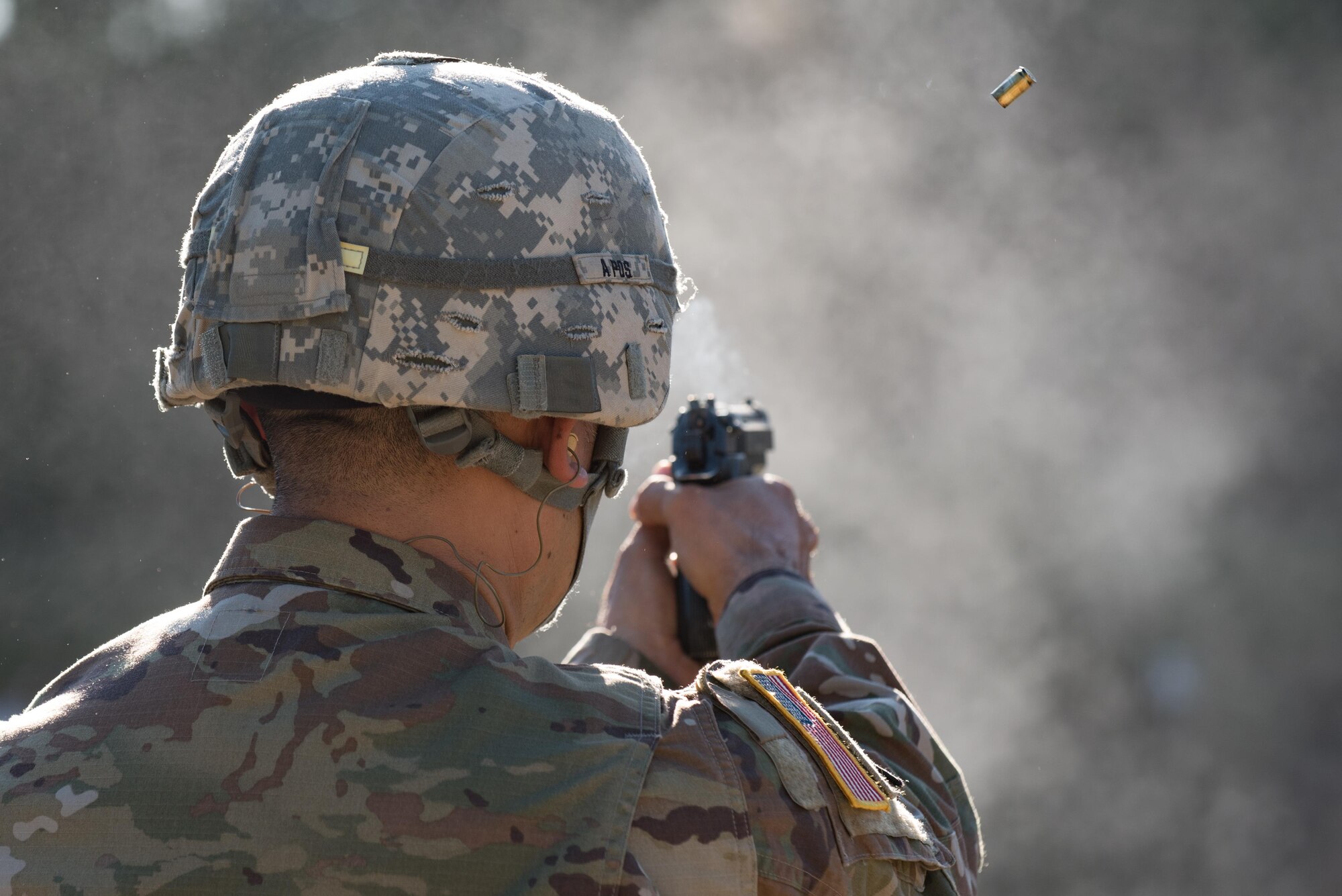 U.S. Army Sgt. Raquel Nunez-Hedrick, German Armed Forces Proficiency Badge competitor, dons her helmet before entering the shooting range at Joint Base Langley-Eustis, Va., Oct. 20, 2017.