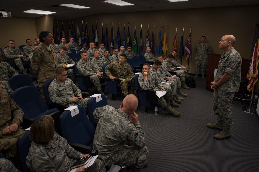 Master Sgt. Tai Gordon, 347 Operations Support Squadron, asks Gen. Mike Holmes, commander of Air Combat Command, a question Oct. 17, 2017 during a visit at Moody Air Force Base, Ga