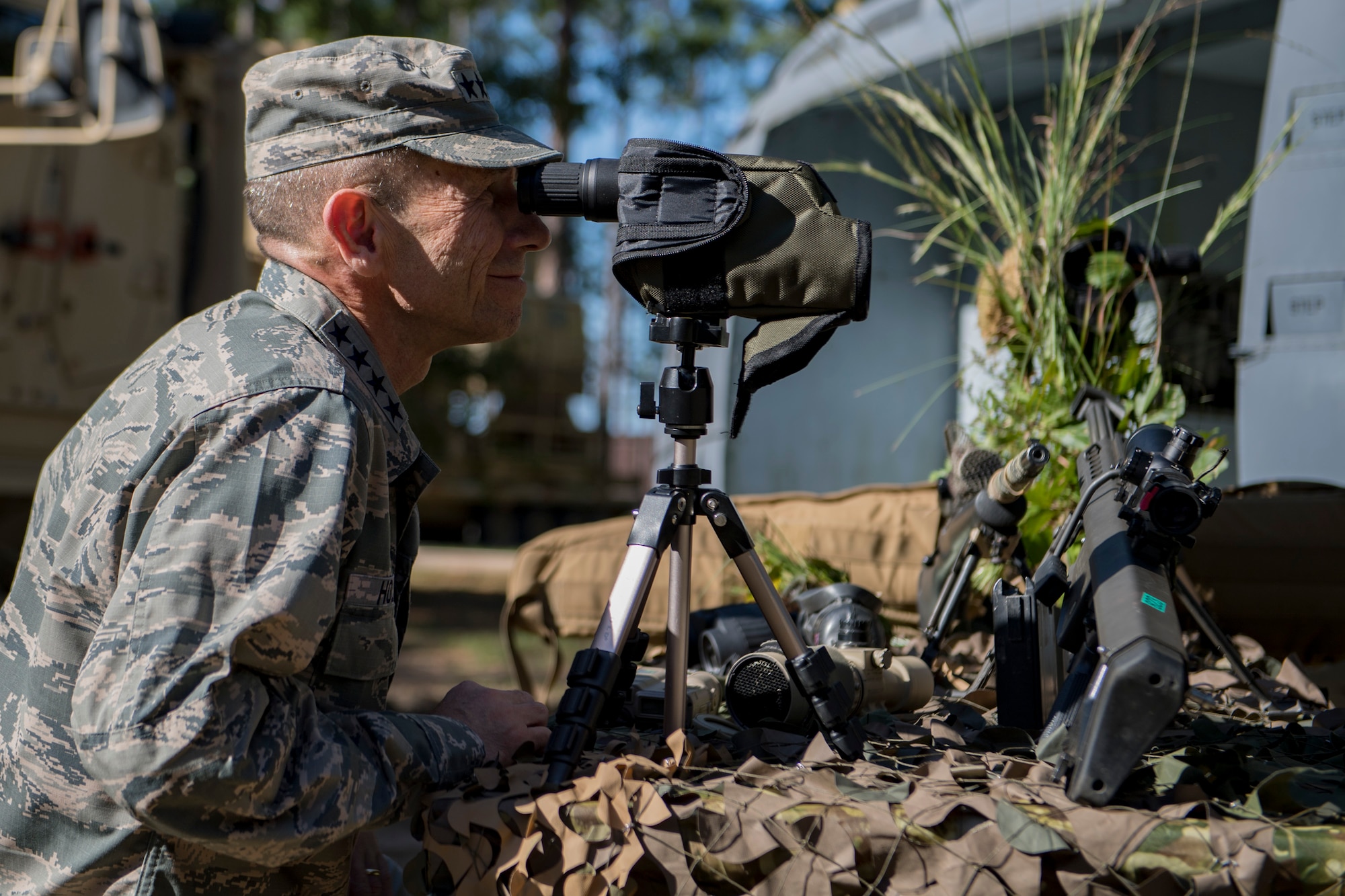 Gen. Mike Holmes, commander of Air Combat Command, looks through a spotter’s scope during a capabilities demonstration by the 820th Base Defense Group, Oct. 18, 2017, at Moody Air Force Base, Ga.