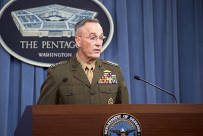 The chairman of the Joint Chiefs of Staff speaks from behind a podium.