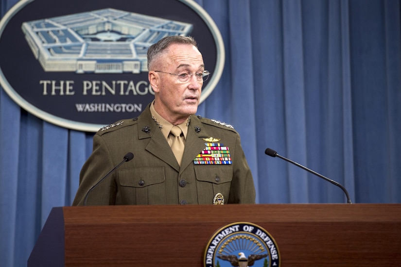 The chairman of the Joint Chiefs of Staff speaks from behind a podium.